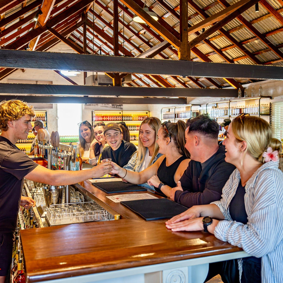 Guests at the Last St tasting bar, served by the team